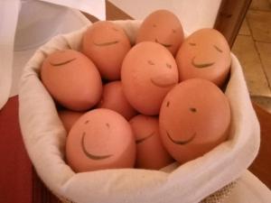 a basket of eggs with faces drawn on them at Hotel Marienhof Baumberge in Nottuln