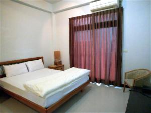 Llit o llits en una habitació de Flower Memory Homestay