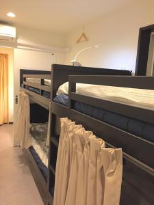 Postel nebo postele na pokoji v ubytování Tokyo Art House