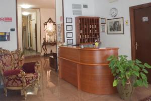 a salon with a wooden bar in a room at Hotel Antico Acquedotto in Rome