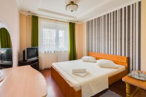 Ένα ή περισσότερα κρεβάτια σε δωμάτιο στο Отель Турист на Саратовской