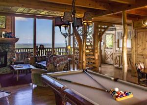 a living room with a pool table in a cabin at Fox Ridge #37 in Sevierville
