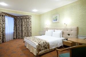 Postel nebo postele na pokoji v ubytování Park Hotel Berezka