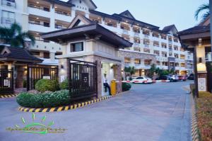a building with a gate in front of a street at Apartelle D' Oasis in Davao City