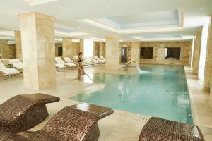 
a large swimming pool in a hotel room at Grand Hotel Kempinski Riga in Riga
