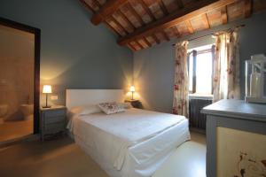 Postel nebo postele na pokoji v ubytování Agriturismo Segnavento