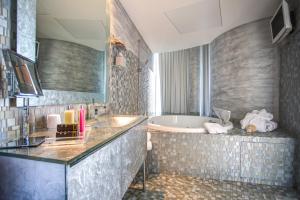 Ванная комната в Hotel Waldorf- Premier Resort