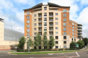 a large apartment building with a round top at Abodebed - Handleys Court in Hemel Hempstead