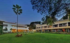 a group of horses in front of a building at Hotel Sunderban Resort & Spa in Pune