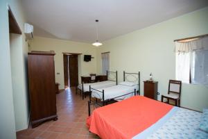 Postel nebo postele na pokoji v ubytování La Casa Del Priore