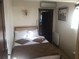 Postel nebo postele na pokoji v ubytování Sultan Palace Hotel