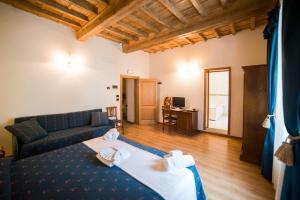 Postel nebo postele na pokoji v ubytování HG Abetone e Piramidi Resort