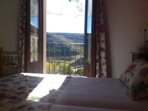 Postel nebo postele na pokoji v ubytování Hotel-Hospedería los Templarios