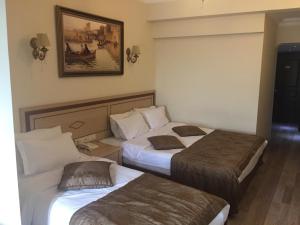Postel nebo postele na pokoji v ubytování Sultan Palace Hotel