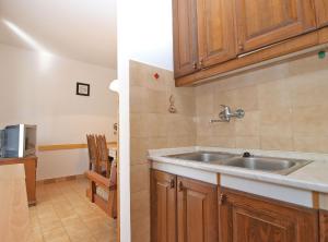 Kuchyňa alebo kuchynka v ubytovaní Apartmensts Nikola 1023 + 37 fotografií