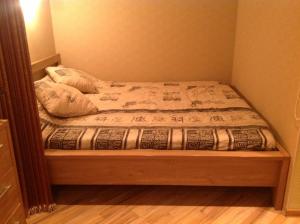 Кровать или кровати в номере Poska Apartment