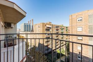 a view from the balcony of a apartment with buildings at ApartEasy - Port Barcelona in Barcelona
