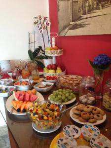 a table with many different types of food on it at B&B Lago Maggiore in Cannobio