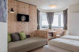Postel nebo postele na pokoji v ubytování Hotel Garni Pirchhütt