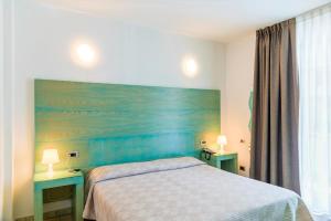 Ein Bett oder Betten in einem Zimmer der Unterkunft Hotel Montecristo