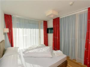 מיטה או מיטות בחדר ב-Penthouse am Sonnenhang