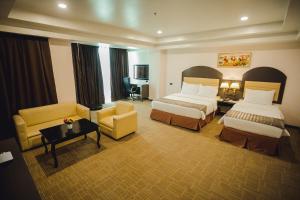 Postel nebo postele na pokoji v ubytování Butuan Grand Palace Hotel + 37 fotografií