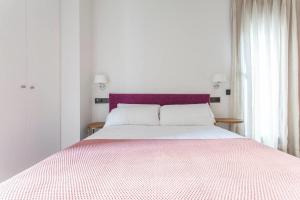 Posteľ alebo postele v izbe v ubytovaní Apartamentos RG Dúplex San Bernardo