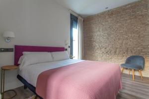 Posteľ alebo postele v izbe v ubytovaní Apartamentos RG Dúplex San Bernardo