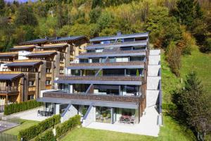 an aerial view of a large building with trees at Penthouse am Sonnenhang in Neukirchen am Großvenediger