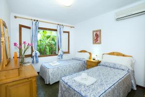 A bed or beds in a room at Owl Booking Villa March - 10 Min Walk to the Old Town