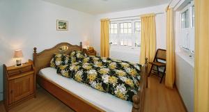 מיטה או מיטות בחדר ב-Haus Edelweiss