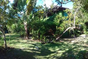 a garden in front of a house at Casa Aldeia de Moreré in Moreré