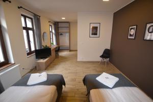 Et opholdsområde på SleepZone Apartments + 23 billeder