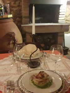 a plate of food on a table at Hotel Il Malandrone in Rosignano Marittimo