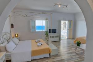 Postel nebo postele na pokoji v ubytování With-inn Mykonos Suites + 37 fotografií