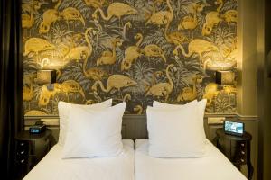 Кровать или кровати в номере Hotel Sint Nicolaas