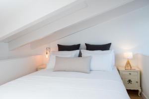 Cama ou camas em um quarto em Lugares Com História