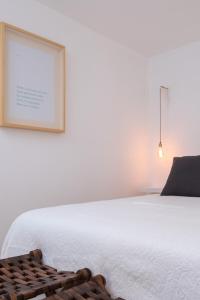Cama ou camas em um quarto em Lugares Com História