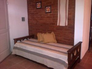 A bed or beds in a room at Complejo Cerros del Sol