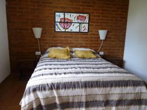 A bed or beds in a room at Complejo Cerros del Sol