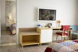 Postel nebo postele na pokoji v ubytování Maison De Camille Boutique Hotel