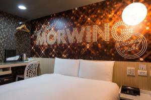 Katil atau katil-katil dalam bilik di Morwing Hotel - Culture Vogue