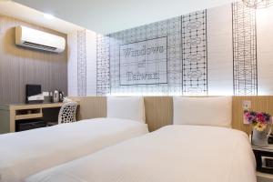 Katil atau katil-katil dalam bilik di Morwing Hotel - Culture Vogue