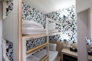 Katil atau katil-katil dalam bilik di Morwing Hotel - Culture Vogue