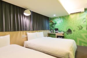 Katil atau katil-katil dalam bilik di Morwing Hotel - Culture Vogue