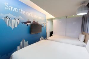 Katil atau katil-katil dalam bilik di Morwing Hotel - Culture Vogue