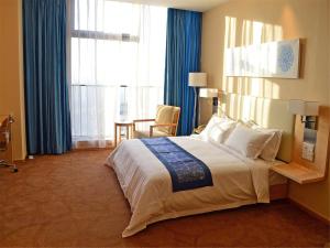 Krevet ili kreveti u jedinici u okviru objekta 石家庄华强诺华廷酒店 Novlion hotel