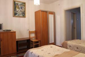 Кровать или кровати в номере Otel Issyk-Kul Karakol