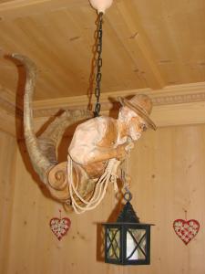 a large bird is hanging from a ceiling at Hotel Villa Gaia in Cortina dʼAmpezzo