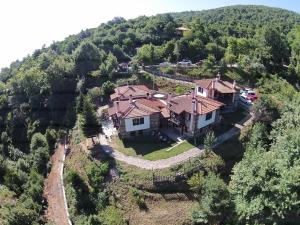 an aerial view of a house on a hill at Kastania Gi in Palaios Panteleimonas